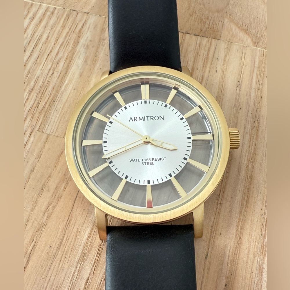 Armitron gold tone with transparent dial black leather watch NEW BATTERY